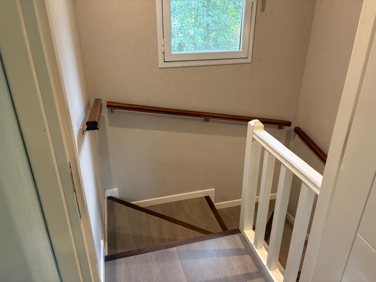 Maravillosa casa rodeada de bosque cerca del golf. 